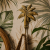 Brass palm tree wall hook styled on warm tropical botanical wallpaper wall with lush palm leaf print – banana tree brass hook polished gold – palm tree coat hook key hook towel hook – boho tropical beach coastal home decor – handcrafted solid brass made in Bali
