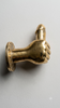 Brass penis hand wall hook minimal side view on white background showing clean profile hand sculpture and mounting plate detail – funny quirky adult after dark kinky decor – man cave dungeon bachelorette housewarming white elephant gift – polished gold brass made in Bali