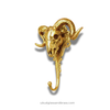 Gold finish brass ram skull wall hook on white background, statement wall hanger for gothic and cottagecore decor
