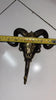 Measuring tape photo showing brass ram skull wall hook width, useful size reference for entryway coat hook wall