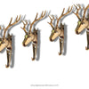 Set of 4 brass reindeer Christmas stocking hooks on mantel