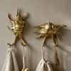 Brass sea shell wall hook set used as bathroom towel hooks coastal nautical beach house decor