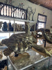Large brass sea turtle sculpture side profile in workshop showing true scale