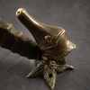 Close-up of brass seahorse door pull head and starfish accent, hand-cast antique detail