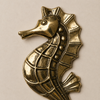Brass seahorse wall hook on a white background, handcrafted piece from the ocean animal coastal hook set.