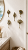 Brass shell wall hooks in coastal bathroom interior beach house styling decor