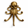 Front view of a brass skull-octopus wall hook in a polished gold finish