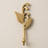 Single brass sprout leaf hook in a polished gold finish on a cream background