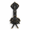 Close up of a brass squid wall hook in a dark aged patina finish