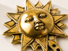 Close-up of polished gold brass sun face wall hook showing detailed hand-cast facial expression and sunburst ray texture – part of celestial brass wall hook set of 3 – solid brass artisan made in Bali – boho witchy celestial home decor – unique astrology housewarming gift – UbudGlassandBrass