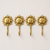 Set of 4 polished gold brass sun wall hooks evenly spaced in a row on white background – front view handcrafted sunburst hook set