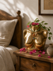 Small brass female torso sculpture on a bedside table with pink flowers — boudoir decor and after dark decor statement, new home gift and gift for her handcrafted in Bali