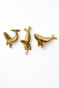 Brass whale and seal wall hooks set isolated on white background coastal nautical home decor