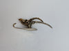 brass antilope skull skeleton with long horns with white background