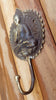 Brass Buddha wall hook mounted on wooden wall for rustic zen decor meditation space styling