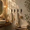 Buddha wall hooks used as towel holders in zen bathroom spa decor, calming minimalist interior design