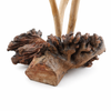 Natural burl wood base of handmade mushroom sculpture showing organic texture and unique formation