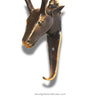 close up image of an antique brass deer head wall hook with white background