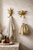 Brass sea shell wall hooks used as bathroom towel holders coastal beach house decor styling