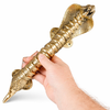 Hand holding cobra door pull at an angle, solid brass snake door handle with detailed scales
