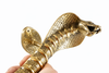 Hand holding cobra door handle side view, solid brass snake door pull showing backplate and finish