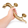 Hand holding solid brass cobra door handle to show size, snake entry door pull statement piece
