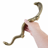 Close up of cobra head on solid brass door handle showing sculptural snake design luxury entry hardware