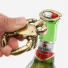 Brass crab bottle opener opening a beer bottle, practical beer lover gift, unique bar tool, gift for him, and fun home bar accessory