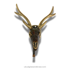 Decorative antique brass deer skull with antlers on a white background