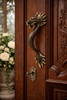Dragon door handle installed on wooden front door decorative brass entry hardware