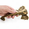 Hand holding brass elephant trunk door handle for scale, solid brass hardware, elephant door pull set, unique door handle and handcrafted Bali decor