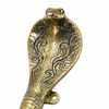 Detailed engraving on solid brass cobra door handle showing decorative patterns and luxury craftsmanship