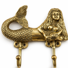 Gold brass mermaid double wall hook front view for coastal bathroom and beach house decor