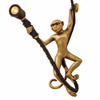 Gold brass monkey wall lamp on a white background, showing the polished gold finish, textured fur detail, curled tail, round wall plate and spotlight. The gold option of this handmade plug-in hanging monkey sconce, with bulb and US plug included (vine shown for styling, not included).