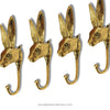 Gold brass rabbit wall hook set of 4 displayed together, bunny wall hooks for cottagecore decor, nursery wall decor, whimsical farmhouse hooks, Peter Rabbit inspired wall hooks