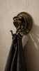 Antique brass eagle snake wall hook in dark academia interior with towel, gothic decor wall hook, moody bathroom styling, double hook design, unique housewarming gift and vintage animal wall hardware