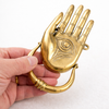 Hamsa hand door knocker in shiny gold brass with Buddha’s eye design for exterior front door hardware
