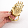 Hamsa hand door knocker gold brass finish shown in hand to demonstrate size and craftsmanship