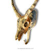 gold brass impala skull with white background