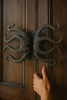 Kraken style octopus double door hardware set on a dramatic entryway