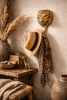 Brass lion wall hook styled in entryway with hat and scarf safari home decor