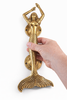 Solid brass mermaid door handle shown in hand for size reference
