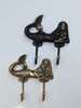 Brass mermaid wall hooks in multiple finishes displayed for coastal and nautical decor