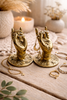 Mini brass Buddha hand hooks used as jewelry holders, set styled with rings and accessories
