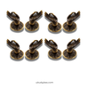 Mini Buddha hand cabinet pulls installed on dark cabinet doors, brass mudra hardware for drawers and cupboards.