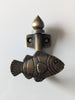 Angled view of brass fish wall hook showing texture and coastal nautical design for home decor