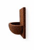 Side profile of orchid wall mount planter made from natural tree fern fiber