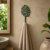 Patina green monstera leaf wall hook holding towel, tropical bathroom decor wall hook