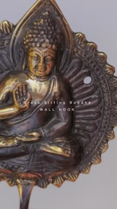 Video showing brass Buddha wall hook with detailed sitting Buddha design and antique finish for zen decor