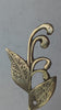 Video showing hand mounting a brass patina sprout leaf hook onto a wall